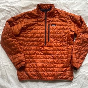 Patagonia half zip burnt orange puffer jacket.